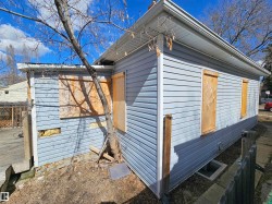 Light blue horizontal siding with white trim - 