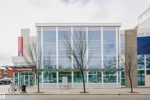Modern commercial building with expansive glass curtain wall facade - 11105 81 Avenue, Edmonton, AB 
