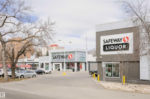 Commercial retail storefronts featuring a prominent Safeway and Safeway Liquor establishment - 11105 81 Avenue, Edmonton, AB 