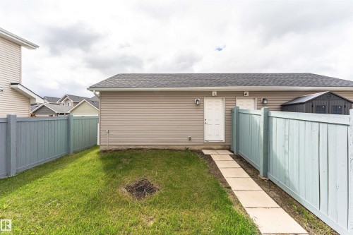Detached garage with horizontal siding and a shingled roof - 2397 Glenridding Boulevard, Edmonton, AB 