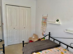 White bi-fold closet doors with panel detailing - 