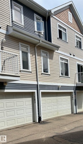 Multi-level townhouse exterior featuring horizontal siding and decorative shingles - 184 1804 70 Street, Edmonton, AB 