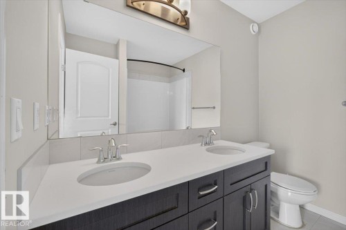 Double vanity with dual undermount sinks and chrome faucets - 2144 51 Street, Edmonton, AB 
