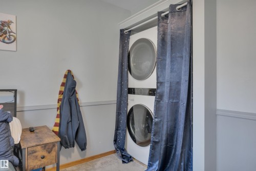 Integrated stackable laundry appliances featuring a front-load washer and dryer - 9835 74 Street, Edmonton, AB 