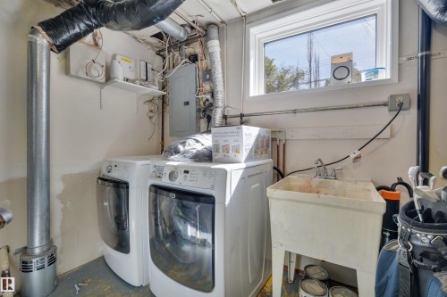 Utility room featuring a window, laundry hookups, and a utility sink - 9835 74 Street, Edmonton, AB 
