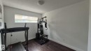 5440 1A Avenue, Edmonton, AB  - Indoor Photo Showing Gym Room 
