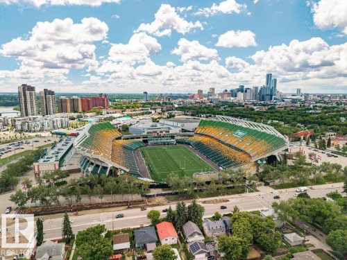 Aerial perspective showcasing a prominent stadium surrounded by urban development - 11241 88 Street, Edmonton, AB 
