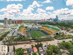 Aerial perspective showcasing a prominent stadium surrounded by urban development - 