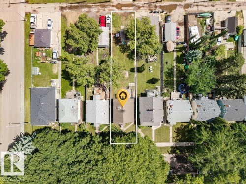 Residential property featuring a rectangular lot, mature trees, and a detached structure - 11241 88 Street, Edmonton, AB 