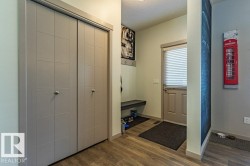 Entryway featuring light wood-finish flooring and neutral wall tones - 