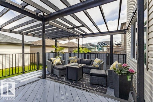 Spacious deck with a slatted pergola overhead - 17123 49 Street, Edmonton, AB 