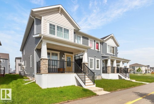 Modern townhome exterior featuring grey siding and light-colored gables - 1022 Hearthstone Boulevard, Sherwood Park, AB 