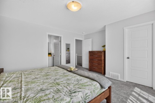 Bedroom featuring light gray walls and plush gray carpet - 1022 Hearthstone Boulevard, Sherwood Park, AB 