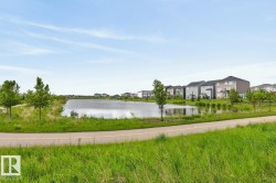Pond-front properties featuring varied architectural styles and private balconies - 