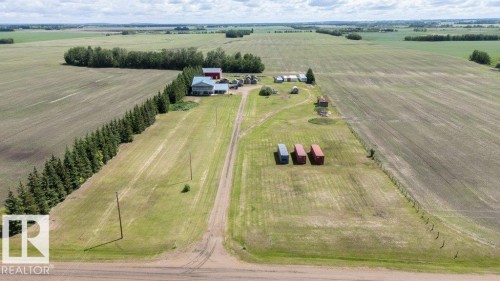 Expansive property featuring a main residence, multiple outbuildings, and extensive cultivated acreage - 58505 Rng Rd 260, Rural Westlock County, AB 