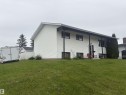 White siding exterior with a covered entry - 66 Maligne Drive, Devon, AB  - Outdoor 