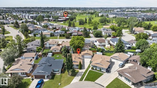 Residential neighborhood featuring single-family homes with pitched roofs and mature landscaping - 14612 29 Street Nw, Edmonton, AB 