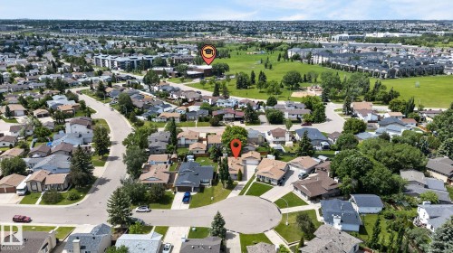 Aerial view of a residential neighborhood with numerous single-family homes, mature trees, and paved streets - 14612 29 Street Nw, Edmonton, AB 