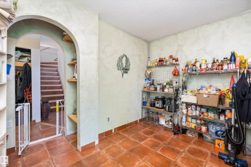 Terracotta floor tiles complement the textured wall finish - 7 53424 Range Road 13, Rural Parkland County, AB 