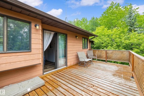Expansive wood-finish deck with lattice railing - 7 53424 Range Road 13, Rural Parkland County, AB 
