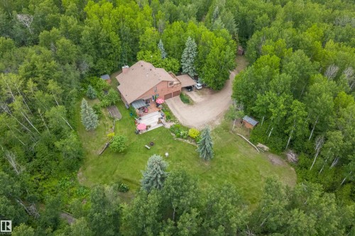 Expansive property featuring a multi-level home surrounded by mature trees - 7 53424 Range Road 13, Rural Parkland County, AB 
