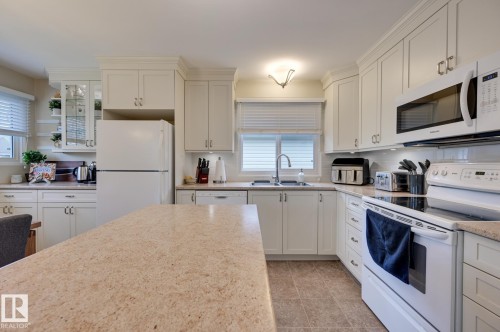 7527 78 Avenue, Edmonton, AB - Indoor Photo Showing Kitchen With Double Sink
