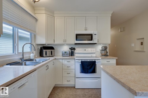 7527 78 Avenue, Edmonton, AB - Indoor Photo Showing Kitchen With Double Sink