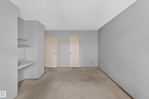 Spacious room with light gray painted walls and neutral carpeting - 178 Tudor Lane, Edmonton, AB 