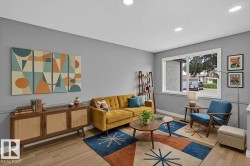 Spacious living area featuring light wood-finish flooring, recessed lighting, a large window, and a built-in trim detail along the lower wall - 