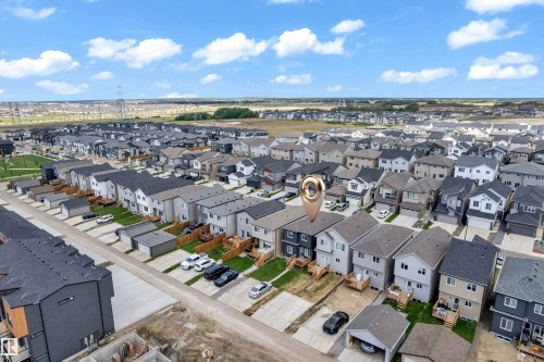 Aerial perspective showcasing a developed residential neighborhood with rows of modern homes - 432 29 Street, Edmonton, AB 