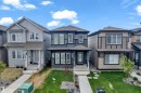 Contemporary two-story residence featuring a dark gray and black exterior with contrasting white window frames - 432 29 Street, Edmonton, AB 