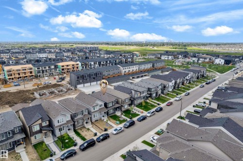 Residential property featuring a light-toned exterior with a dark roof - 432 29 Street, Edmonton, AB 