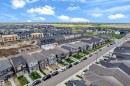 Residential property featuring a light-toned exterior with a dark roof - 432 29 Street, Edmonton, AB 