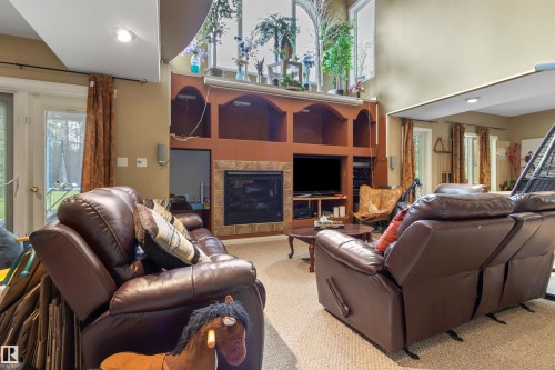 #302 49006 Range Road 73, Rural Brazeau County, AB - Indoor Photo Showing Living Room With Fireplace