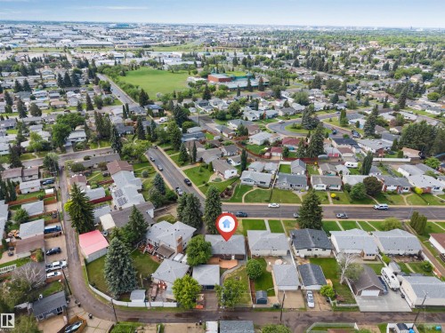 Aerial perspective showcasing a residential neighborhood with tree-lined streets and established homes - 6404 88 Avenue, Edmonton, AB 