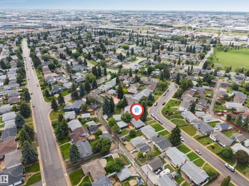 Aerial view of a residential neighborhood with established homes and mature trees - 6404 88 Avenue, Edmonton, AB 