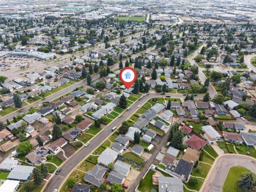 Aerial perspective showcasing a residential neighborhood with tree-lined streets - 6404 88 Avenue, Edmonton, AB 
