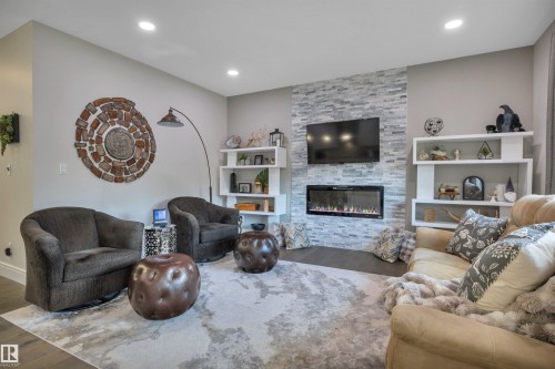 5426 66 Street, Beaumont, AB - Indoor Photo Showing Living Room With Fireplace