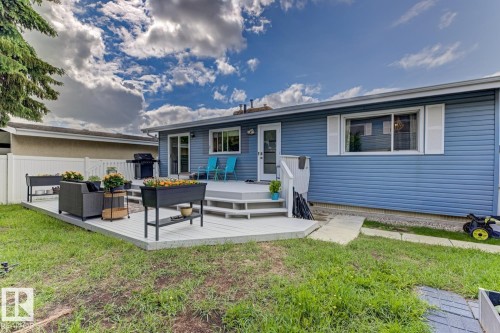 Expansive rear deck featuring light gray decking and a multi-level design - 3504 102 Avenue, Edmonton, AB 