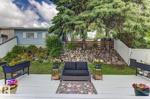 Spacious outdoor deck featuring light-colored decking - 3504 102 Avenue, Edmonton, AB 
