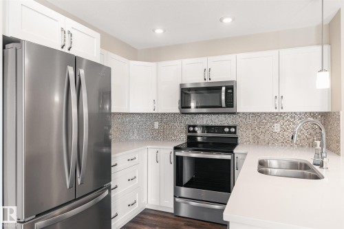 #210 1029 173 St Sw, Edmonton, AB - Indoor Photo Showing Kitchen With Double Sink With Upgraded Kitchen