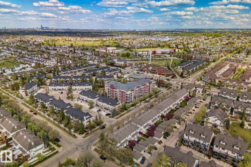 Expansive aerial capturing a vibrant urban landscape with diverse residential architecture and verdant green spaces - 209 5280 Terwillegar Boulevard, Edmonton, AB - Outdoor With View