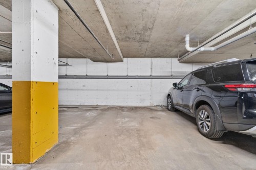 Dedicated parking space within a concrete subterranean garage - 209 5280 Terwillegar Boulevard, Edmonton, AB - Indoor Photo Showing Garage