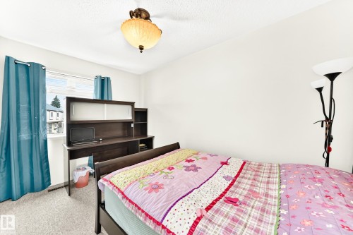 Bedroom featuring light-colored carpet flooring and white walls - 102 Royal Terrace, Edmonton, AB 