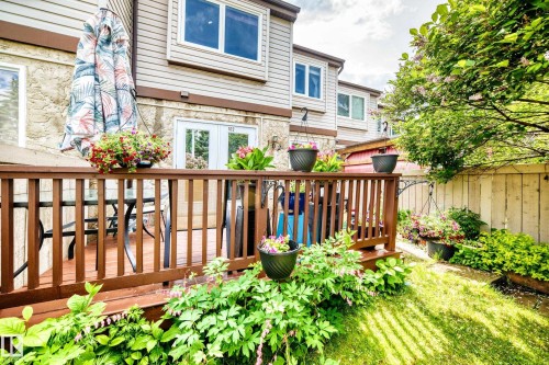 Private outdoor deck with wood railing, offering exterior access via double French doors - 102 Royal Terrace, Edmonton, AB 
