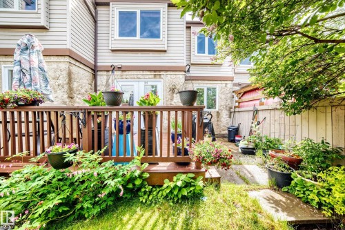 Multi-level wood-finish deck with vertical balusters - 102 Royal Terrace, Edmonton, AB 