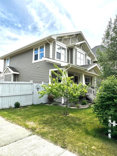 Two-story residence featuring grey horizontal siding and white trim - 2523 Pegasus Boulevard, Edmonton, AB 