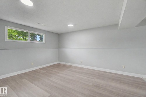 Finished interior room with light wood-finish flooring - 1511 75 Street, Edmonton, AB 
