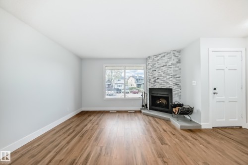 3510 41B Avenue, Edmonton, AB - Indoor Photo Showing Living Room With Fireplace