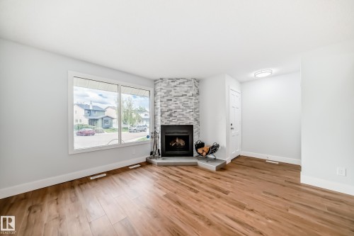 3510 41B Avenue, Edmonton, AB - Indoor Photo Showing Living Room With Fireplace